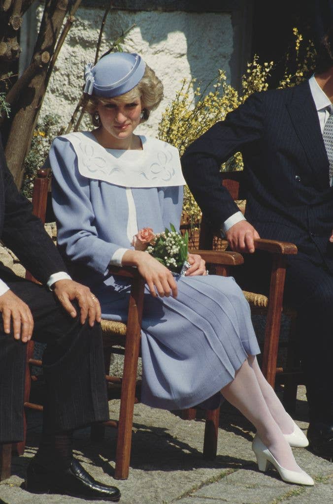 Diana, Princess of Wales in blue and white dress with collar sitting down