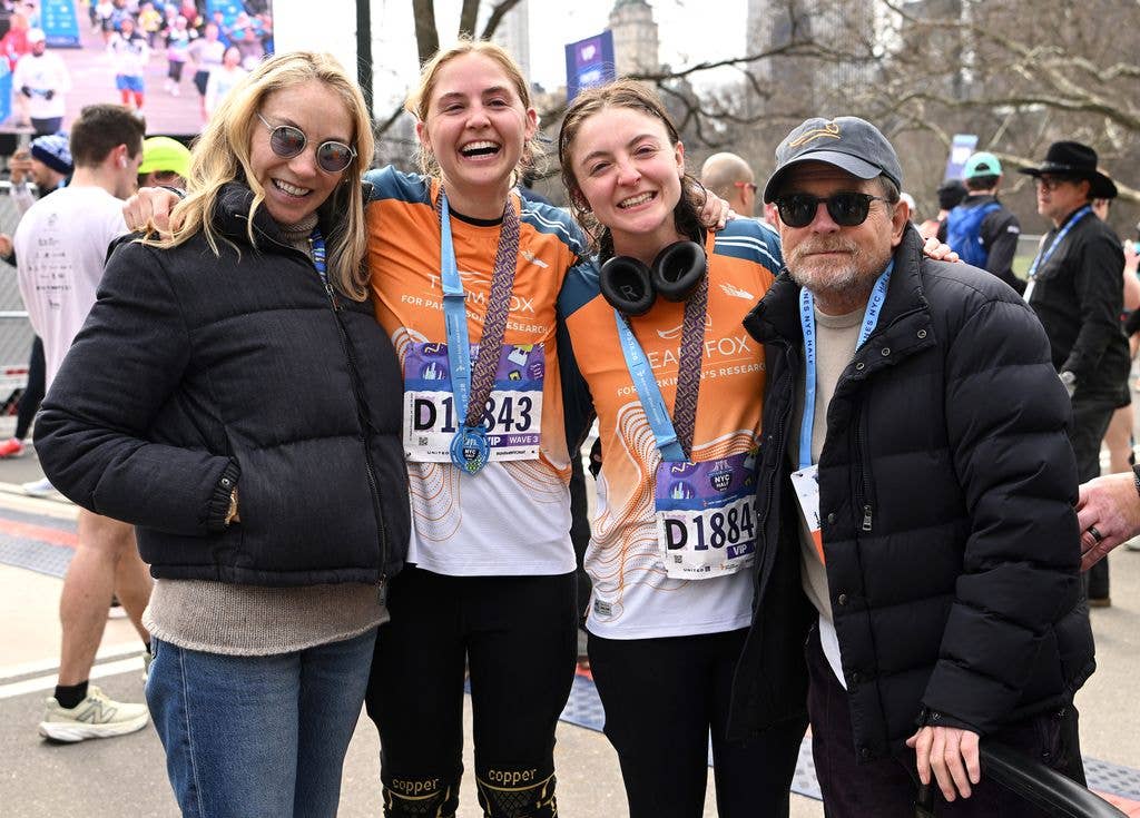 Tracy Pollan, Schuyler Fox, Esme Fox and Michael J. Fox pose at the finish line during the 2026 United Airlines NYC Half Marathon in Central Park on March 15, 2026 in New York City.