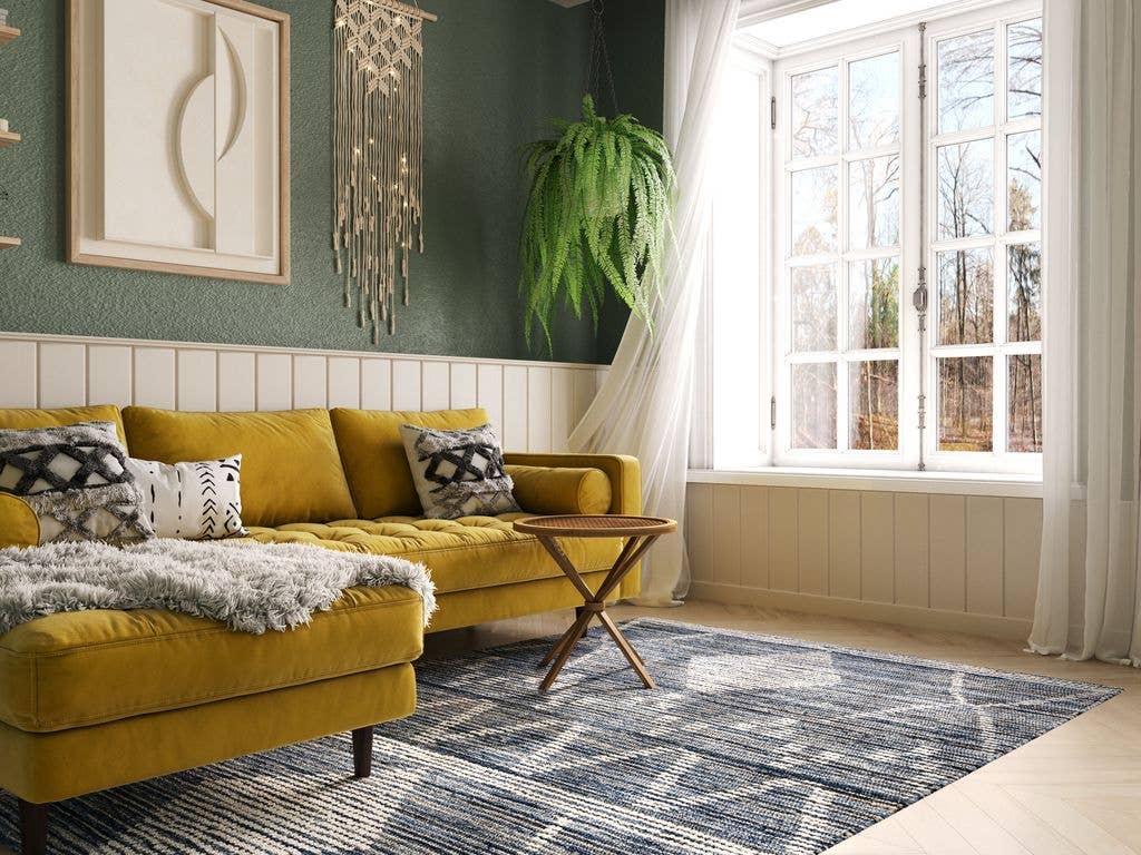 Vintage Cozy Living Room Interior with Yellow Sofa, White Wood Panelling and Green Walls.