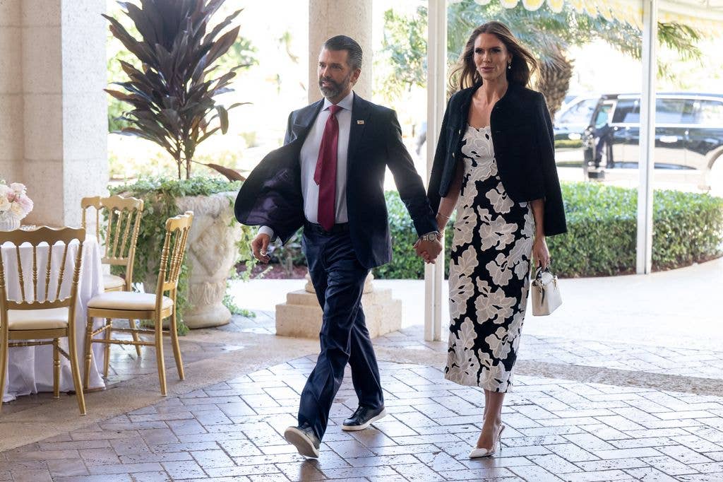 Donald Trump Jr. and his fiancee Bettina Anderson arrive to attend the wedding of Dan Scavino, White House Deputy Chief of Staff, and Erin Elmore, the Department of State Director of Art in Embassies, at Mar-a-Lago in Palm Beach, Florida, February 1, 2026.