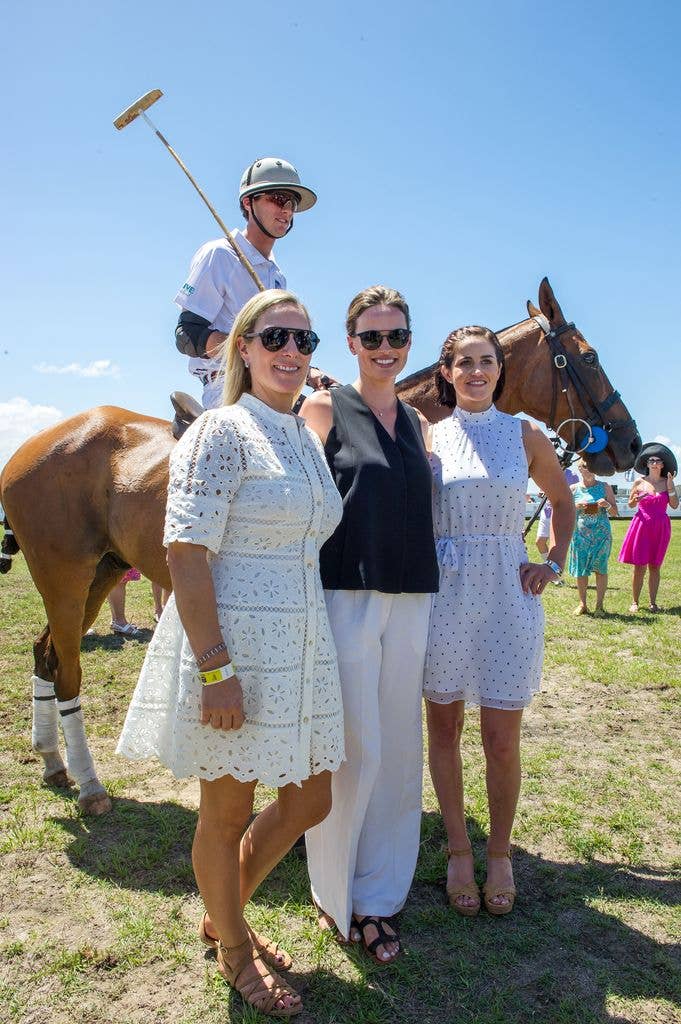 Zara and friends in front of man on horse