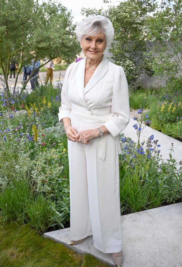 Angela Rippon wears a cream jumpsuit