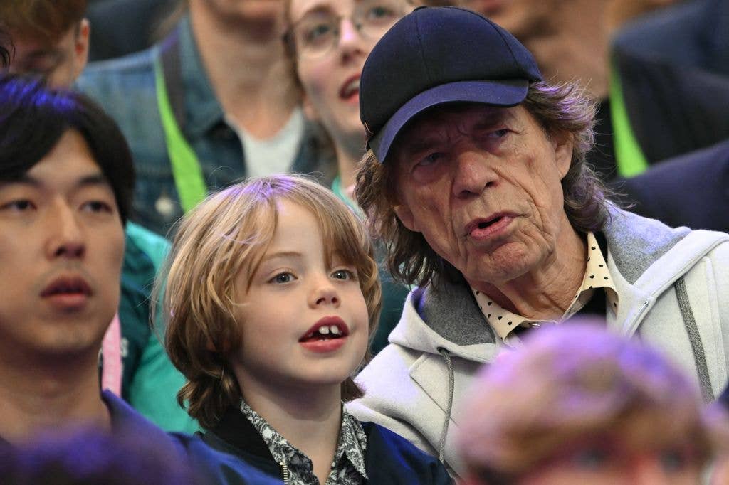 Mick Jagger leans in to talk to son Deveraux Octavian Basil Jagger at a fencing competition during the 2024 Paris Olympics.