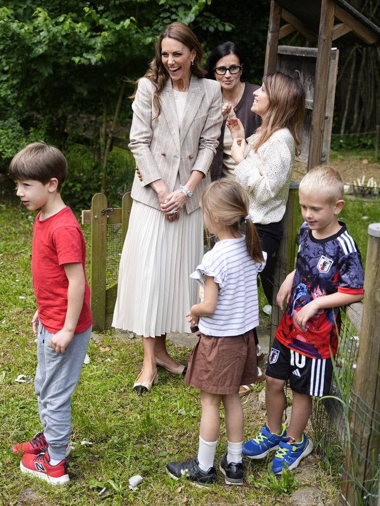 The Princess of Wales outside with group of children