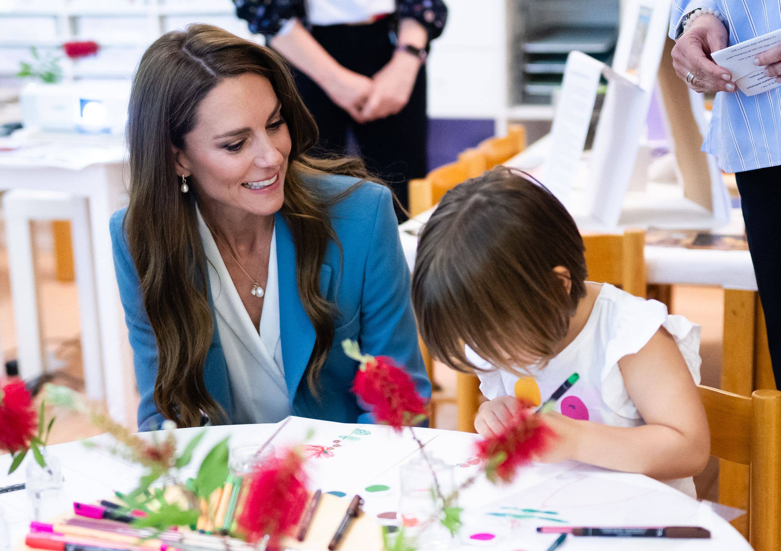 Kate Middleton watching children draw flowers