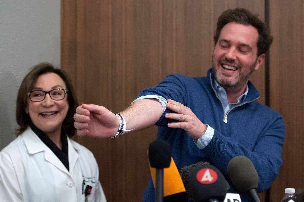 NEW YORK, NY - FEBRUARY 21:  Dr. Sona Degann (L) looks on as Christopher O'Neill, husband of H.R.H. Princess Madeleine of Sweden, shows a footprint on his arm from his newborn daughter at NewYork-Presbyterian/ Weill Cornell Medical Center on February 21, 2014 in New York City. 31-year-old Princess, whose full title is Madeleine Therese Amelie Josephine, Princess of Sweden, Duchess of Halsingland and Gastrikland, is fourth in line to the throne of Sweden. She married US-British banker Christopher O'Neill in June, and the couple announced in September that they were expecting their first child. "The Office of the Marshal of the Realm is delighted to announce that H.R.H. Princess Madeleine gave birth to a daughter on February 20, 2014 at 10.41 pm local time New York," the Swedish court said. "Both mother and child are in good health."   (Photo by D Dipasupil/GC Images)
