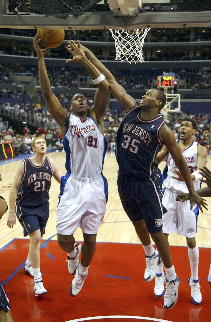 photo of jason collins jumping up near hoop