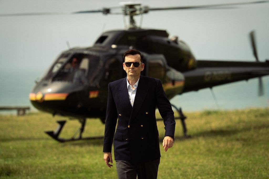 man walking away from helicopter