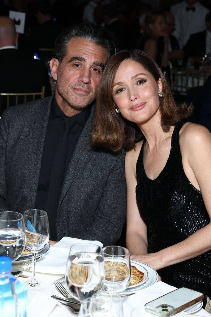 Bobby Cannavale and Rose Byrne sit next to one another at a formal table at the Gotham Awards in 2025.