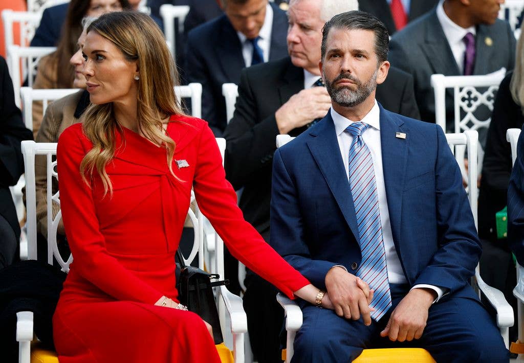 Donald Trump Jr. (R) sits with his girlfriend Bettina Anderson prior to a Presidential Medal of Freedom ceremony in the Rose Garden of the White House on October 14, 2025 in Washington, DC. Today marks the National Day of Remembrance for Charlie Kirk who was shot and killed on September 10th at Utah Valley University.