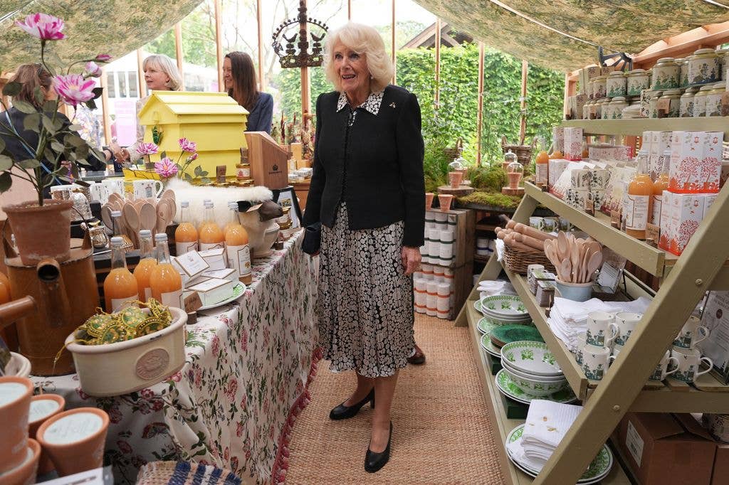 Britain's Queen Camilla looks views exhibits in the Highgrove shop, at the 2026 RHS Chelsea Flower Show in London on May 18, 2026