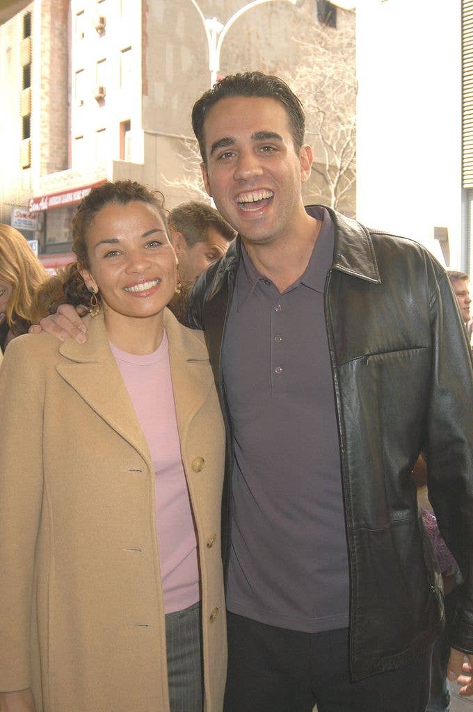 Actor Bobby Cannavale and wife Jenny Lumet. Bobby wears a dark shirt and black leather jacket, Jenny wears a pink knitted top and a beige coat.