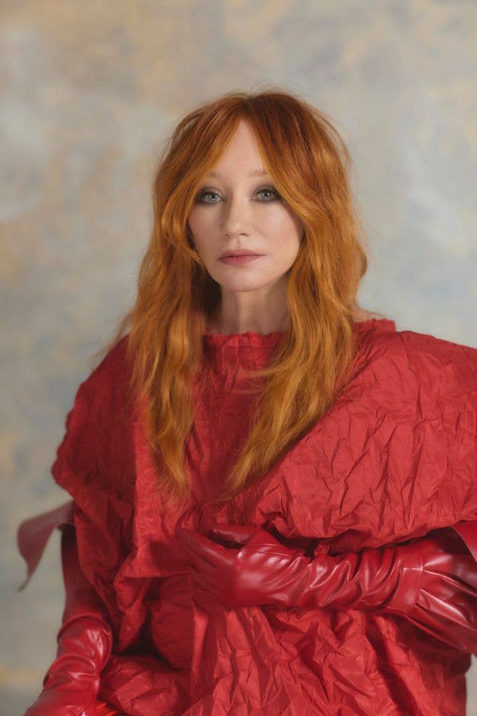 Tori Amos in a red jacket with long red hair