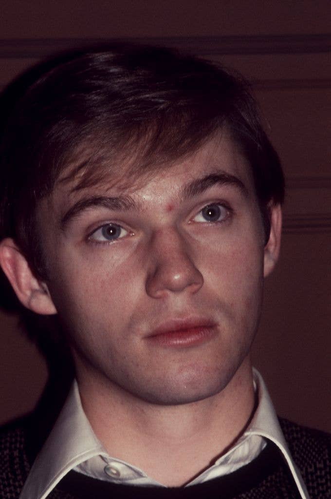 Close up of Richard Thomas wearing a brown sweater 