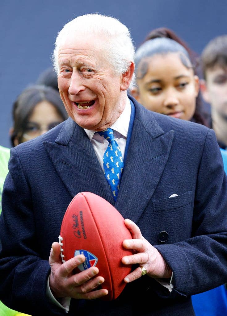 A King ready for kickoff! Charles was presented with an American football while visiting Tottenham Hotspur Stadium in 2025.