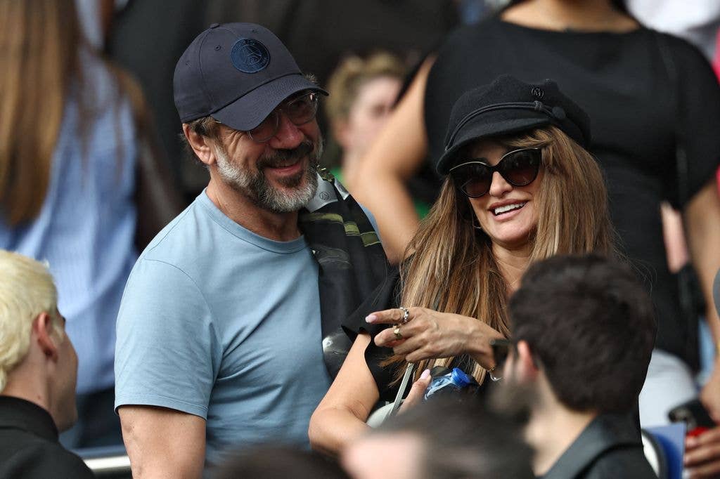 Spanish actor Javier Bardem (L) and Spanish actress Penelope Cruz (R) look on in the stands during the French L1 football match between Paris Saint-Germain (PSG) and FC Lorient at Parc des Princes stadium in Paris on May 2, 2026. 