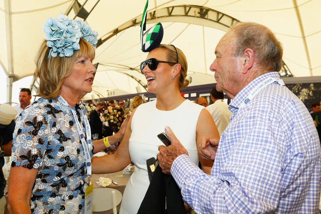 Zara talking to man and woman in tent