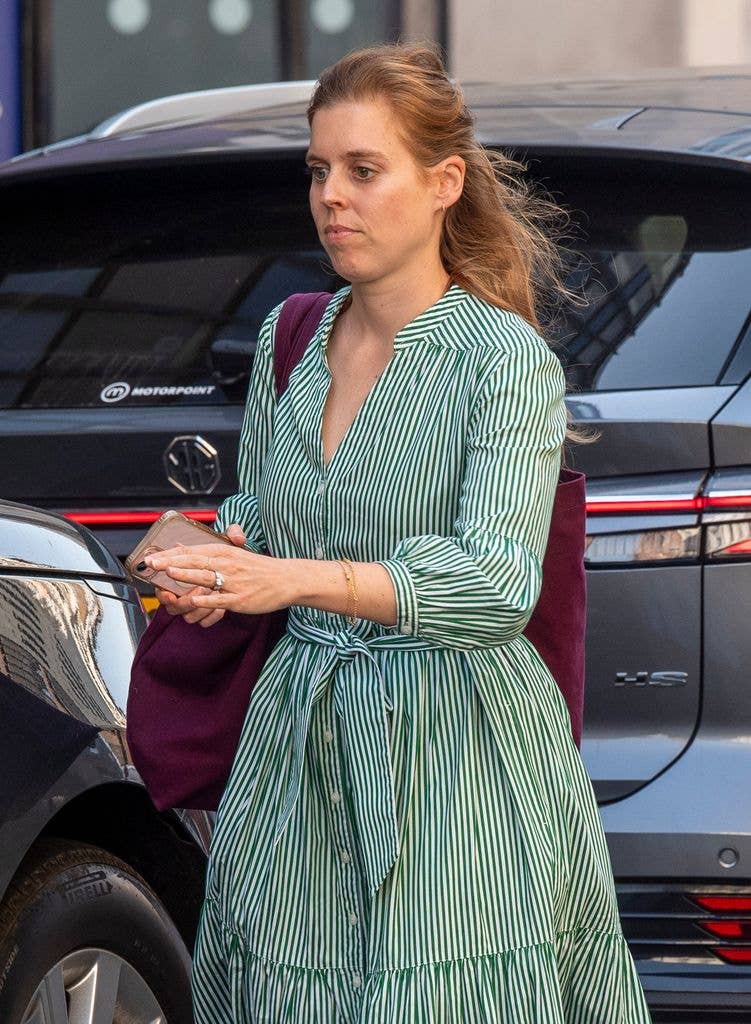 Princess Beatrice is seen for the first time since being absent from Royal Ascot. The Royal was running errands in Mayfair on the hottest day of the year. Beatrice was seen wearing a Cefinn Alice Belted Midi Dress and large Burgundy tote bag. 