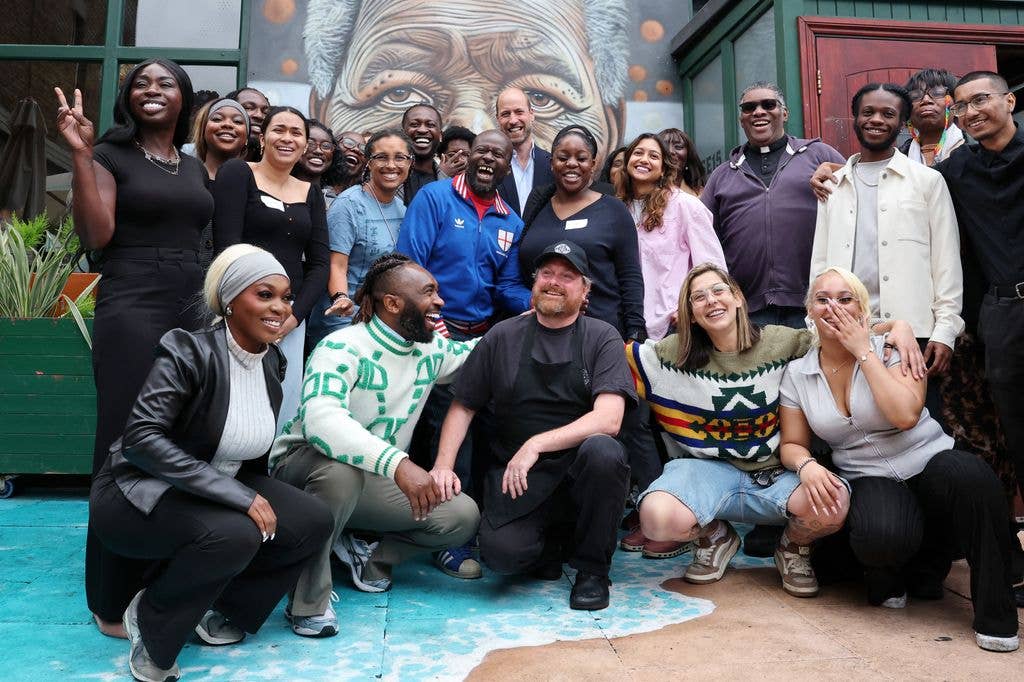Prince William poses for a photograph with staff and members of the community outside The Prince of Peckham Pub in Peckham, south east London on June 3, 2026