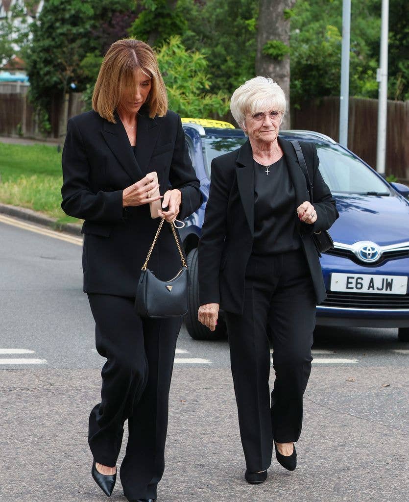 A photo of Sandra and Joanne Beckham wearing black