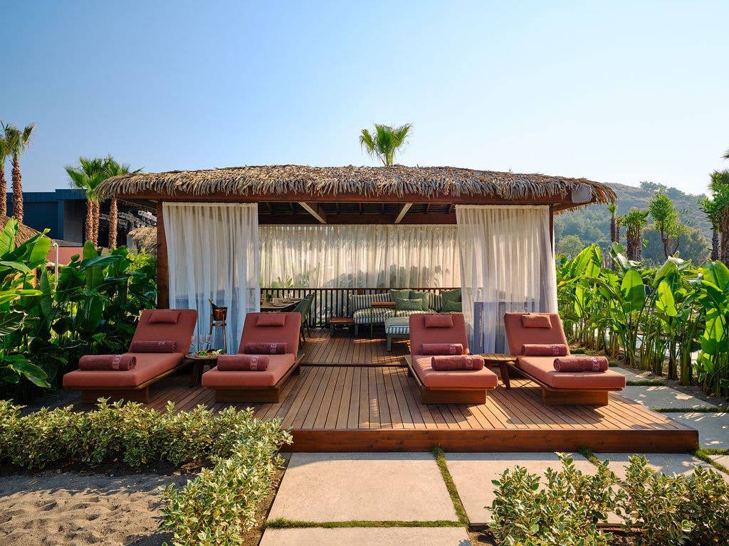 The cabanas are the perfect spot to relax while the kids play in the sand