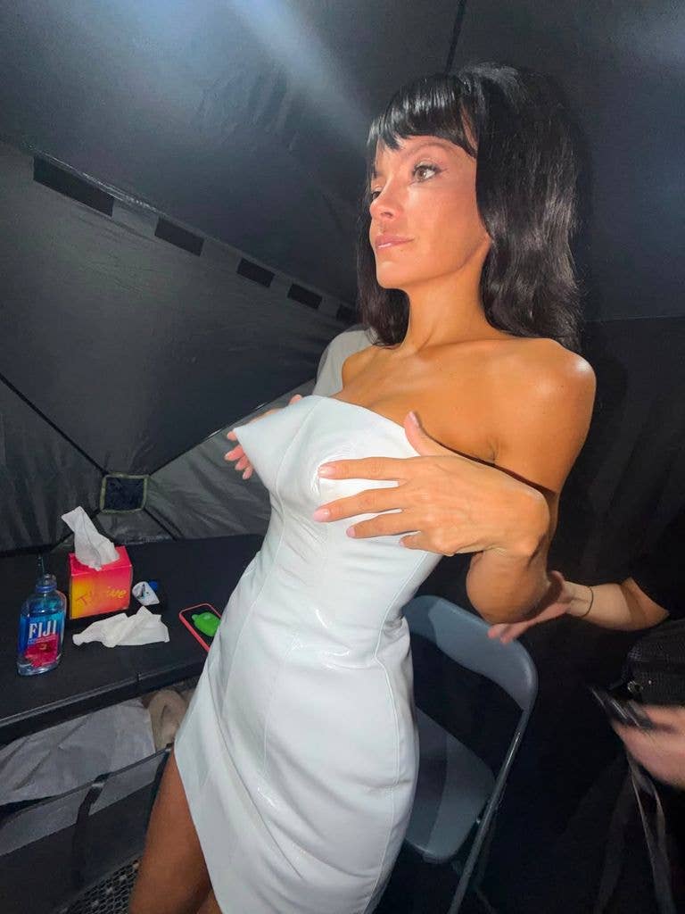 A photo of Lily Allen wearing a white strapless dress
