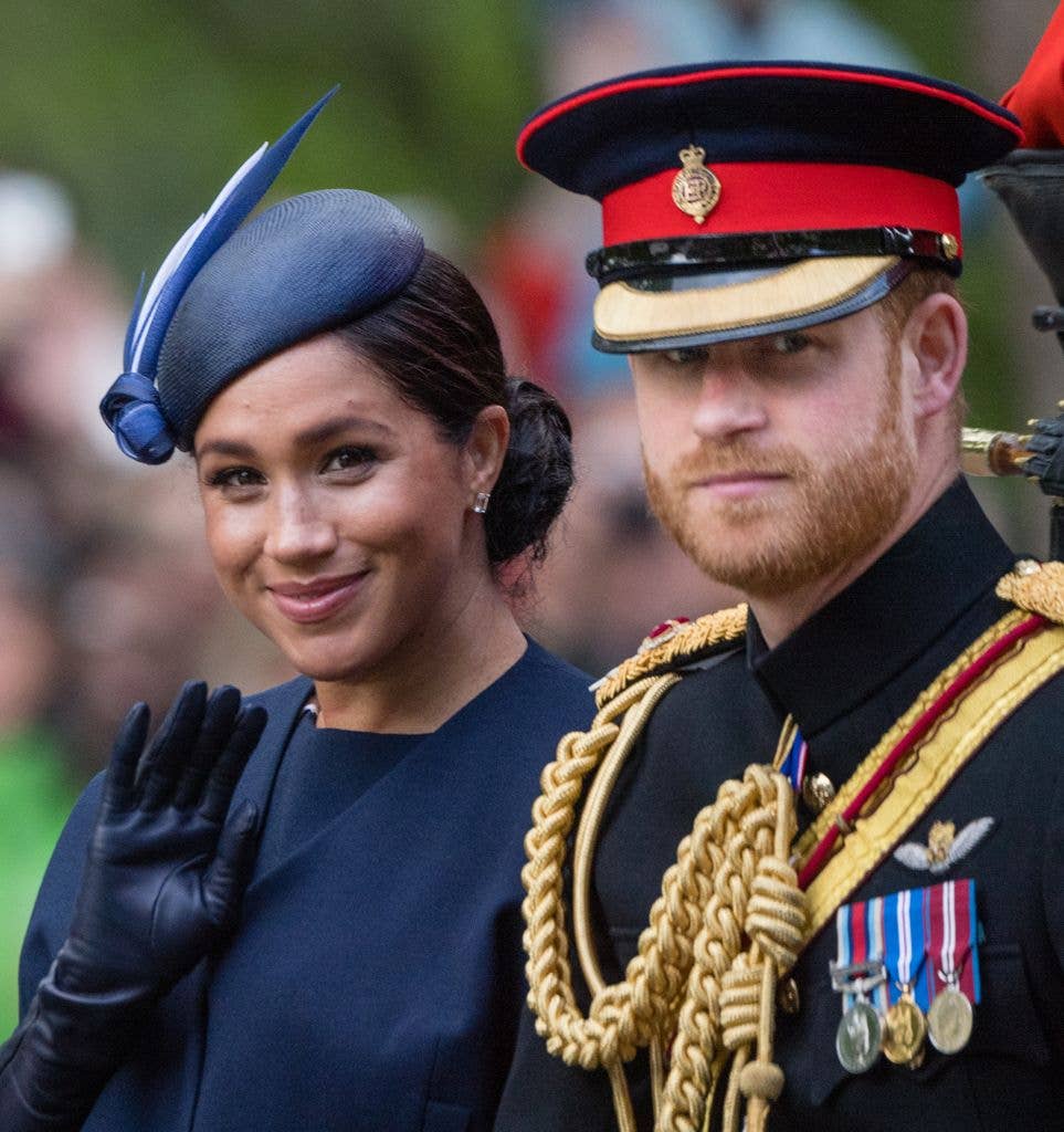 Meghan Markle and Prince Harry riding in a carriage