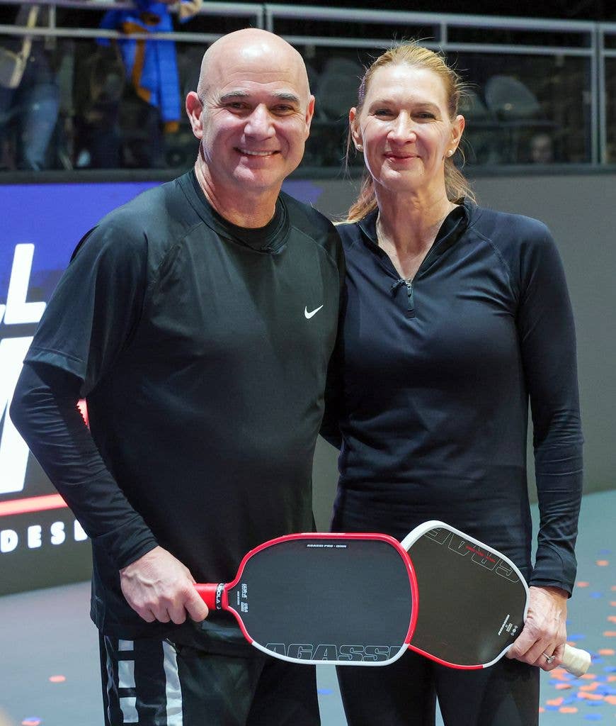 Andre Agassi (L) and Steffi Graf pose on the court after winning the Pickleball Slam 3 championship at Michelob ULTRA Arena on February 16, 2025.