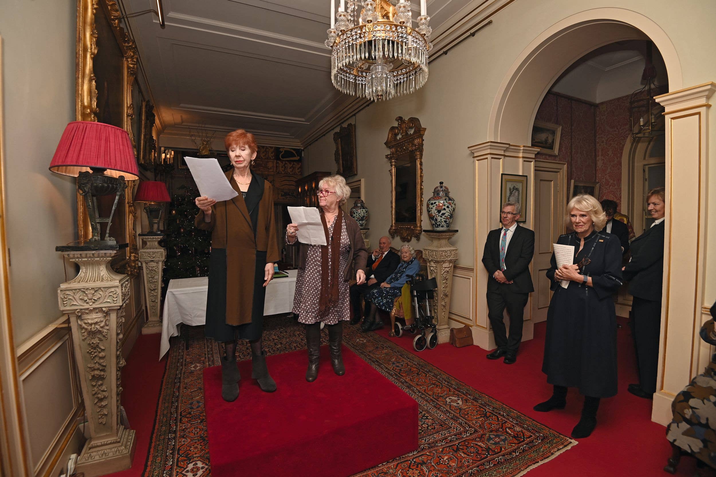 Sunny Ormonde (centre) performs as Lillian Bellamy alongside Carole Boyd (left) at Clarence House as Queen Camilla, then the Duchess of Cornwall, looks on, in 2021