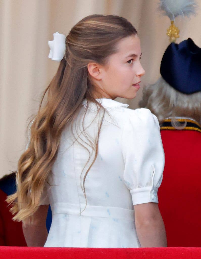 Princes Charlotte at the Trooping The Colour 2026, photographed from behind with her hair looking long and swishy