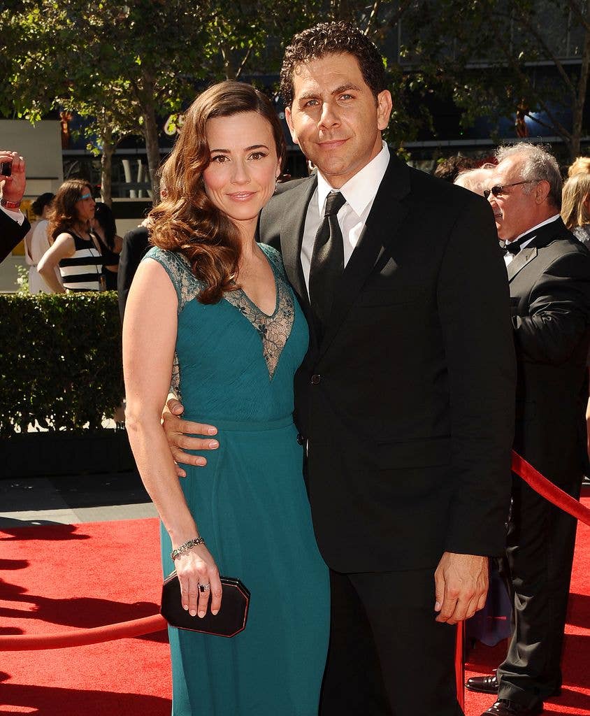 Actress Linda Cardellini and husband Steven Rodriguez attend the 2013 Creative Arts Emmy Awards at Nokia Theatre L.A. Live on September 15, 2013 in Los Angeles, California.