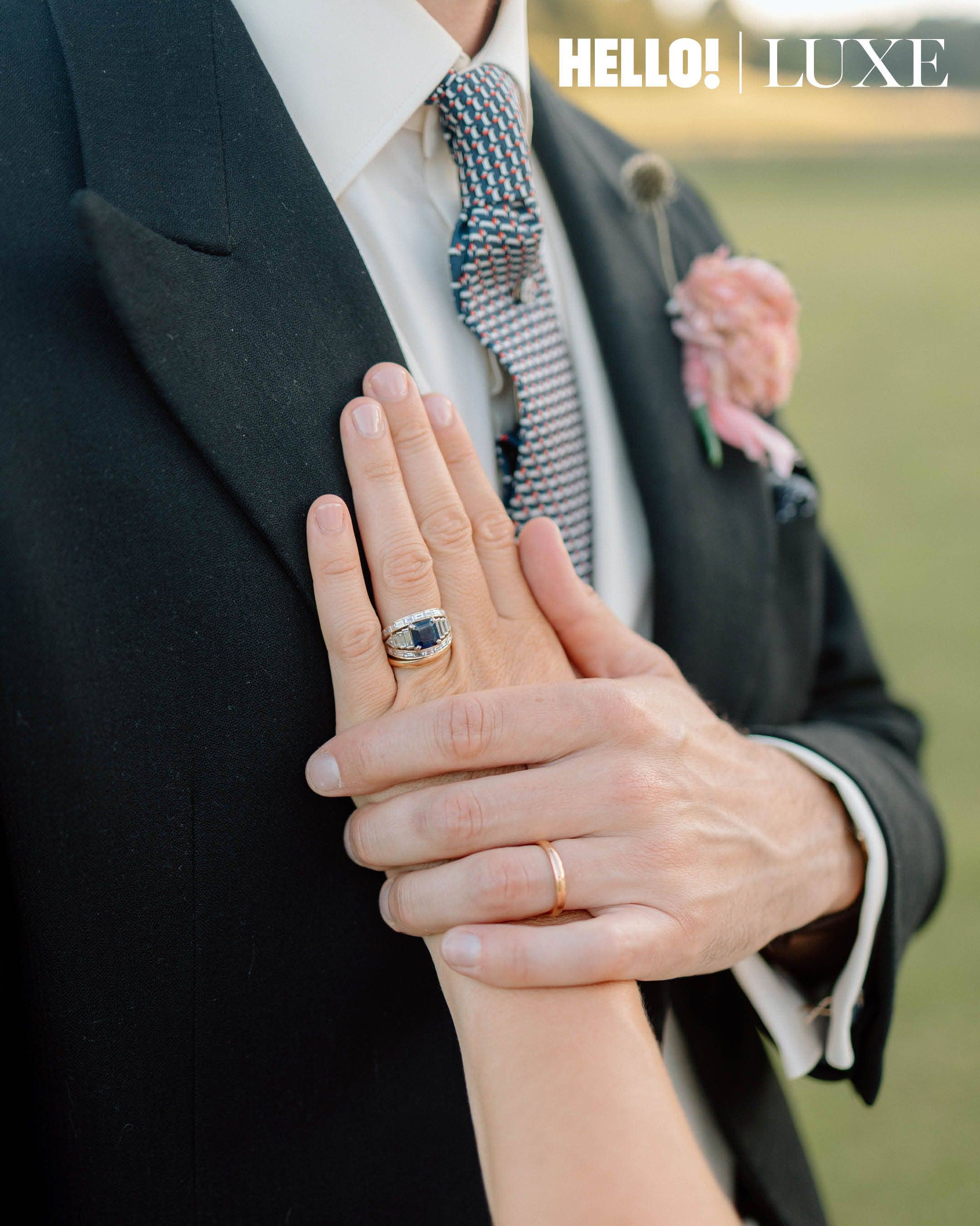 A closer look at the couple's wedding rings, highlighting Lady Marina's modified heirloom engagement ring - originally belonging to Nico’s grandmother - which features a platinum sapphire and baguette diamonds.