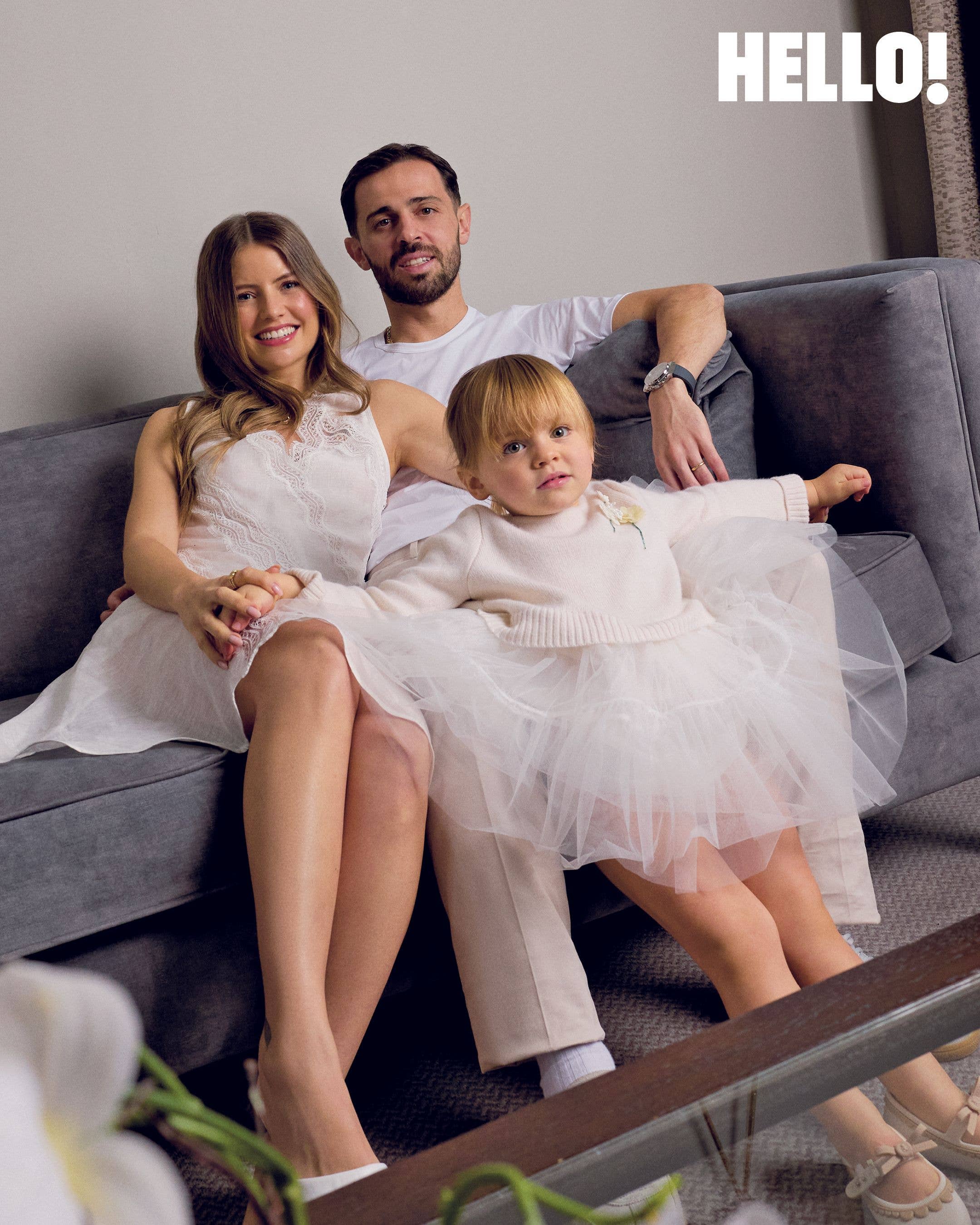 InĂȘs and Bernardo Silva with their toddler Carlota, who is wearing a tulle skirt