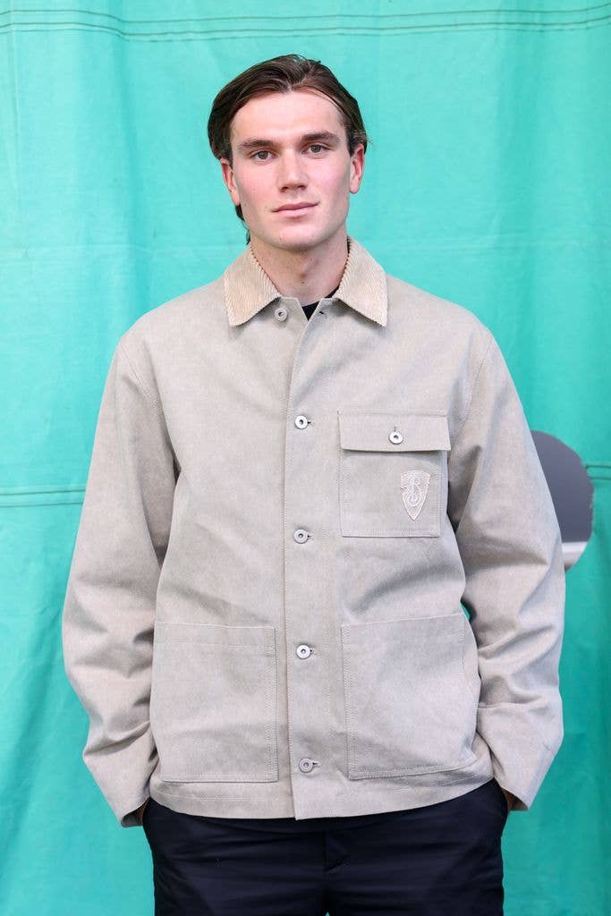 Jack Draper in a grey shirt and black trousers at London Fashion Week in 2025.