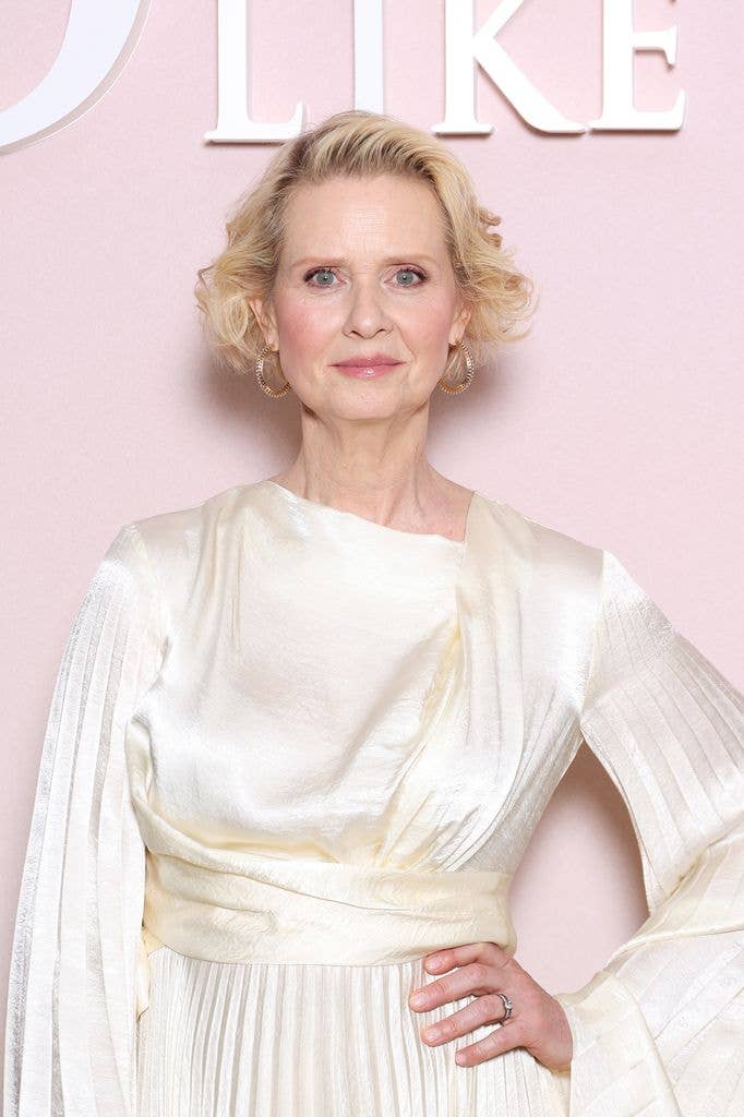 Cynthia Nixon in a draped and pleated cream silk dress at the Season three photo call for 'And Just Like That'.