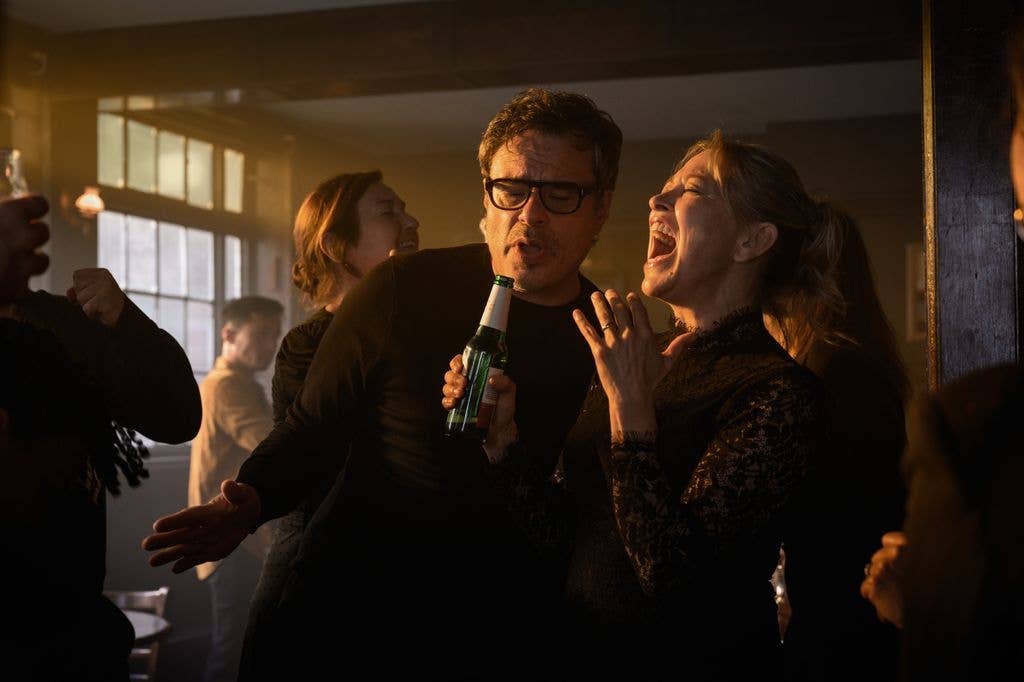 man and woman singing in bar