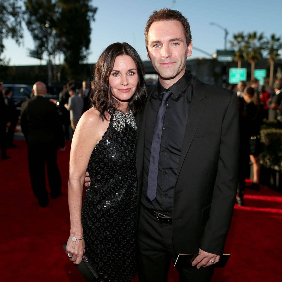 Actress Courteney Cox (L) and songwriter Johnny McDaid attend The 57th Annual GRAMMY Awards at the STAPLES Center on February 8, 2015 in Los Angeles, California. 