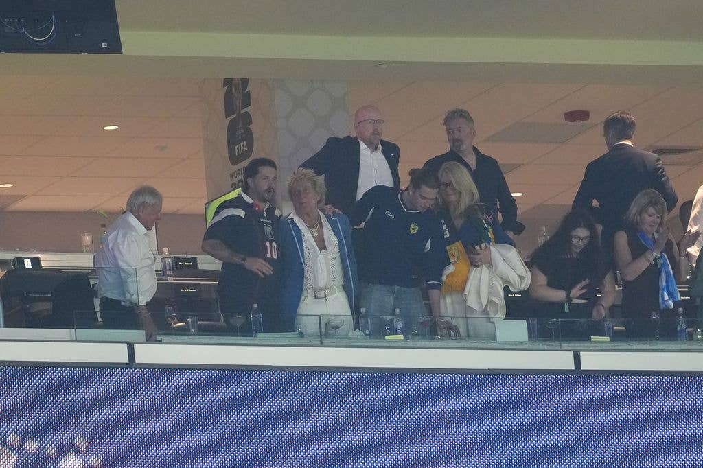 Sir Rod Stewart (third left) celebrates in the stands 