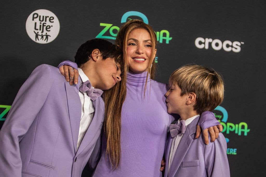 photo of shakira hugging her two sons