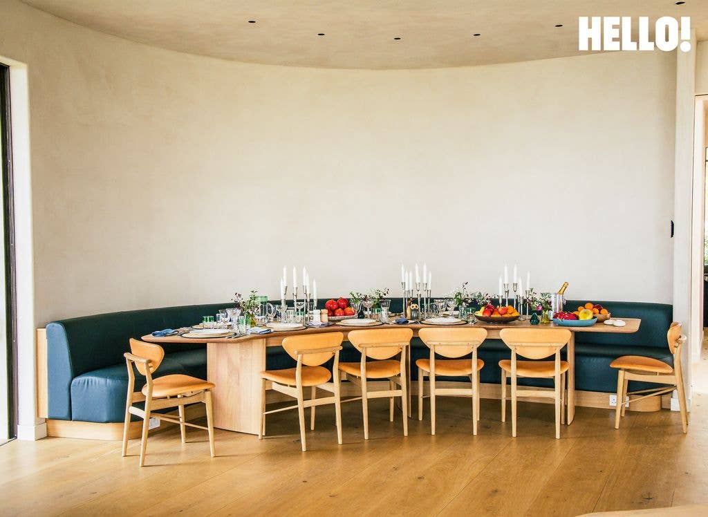 The curved kitchen table by Forest to Home in their Cotswolds Leaf House