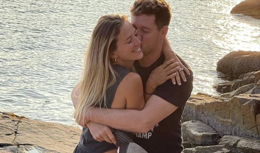 photo of michael buble kissing wife Luisana 