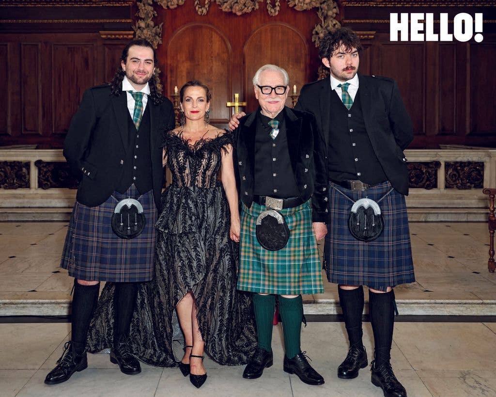 Brian, in a traditional Scottish kilt, and Nicole, wearing a couture dress sourced from a charity shop, with their sons, Orson and Torin