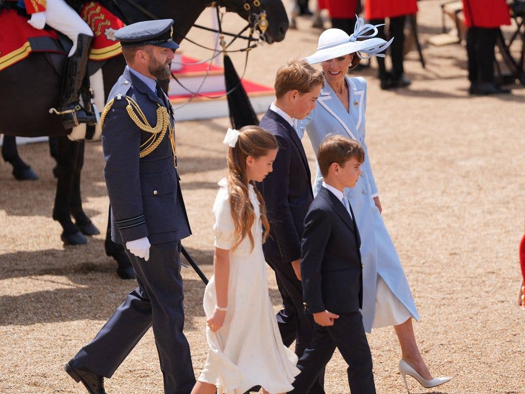 Princess Kate talking to Prince George on the way back to their carriage