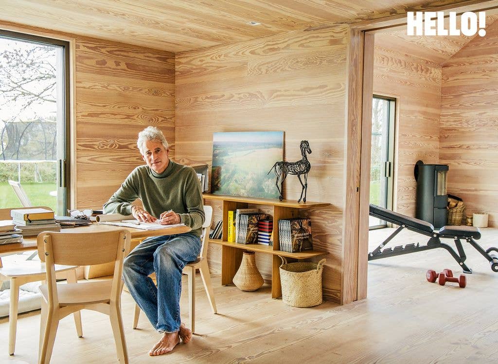 Alex in his study which opens into the gym and yoga studio in their Cotswolds Leaf House