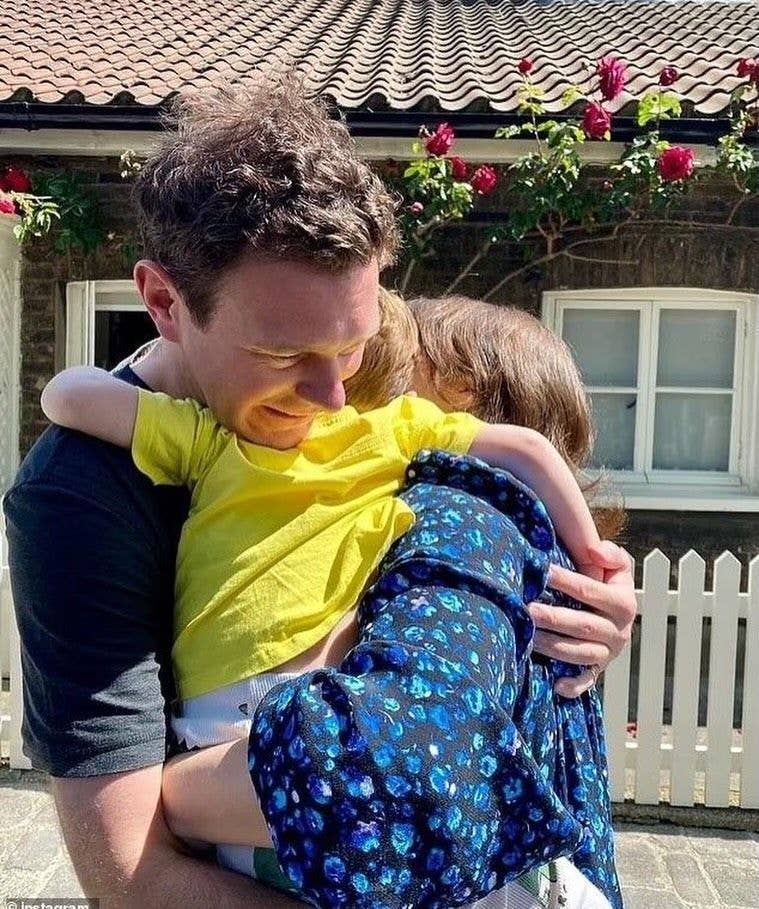 Jack Brooksbank hugging his two sons Ernest and August