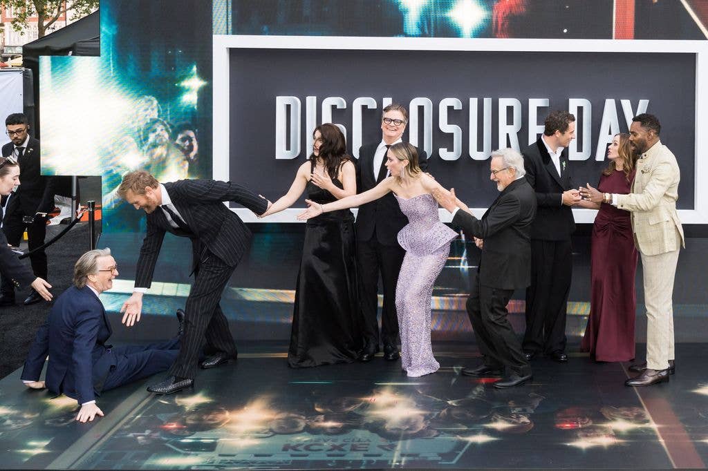 David Koepp is helped up by Wyatt Russell after slipping on the floor, while Eve Hewson, Colin Firth, Emily Blunt and Steven Spielberg react, Josh OÃ¢Connor, Kristie Macosko Krieger and Colman Domingo chat as they attend the UK premiere of 'Disclosure Day' at Cineworld Leicester Square in London, United Kingdom on June 04, 2026