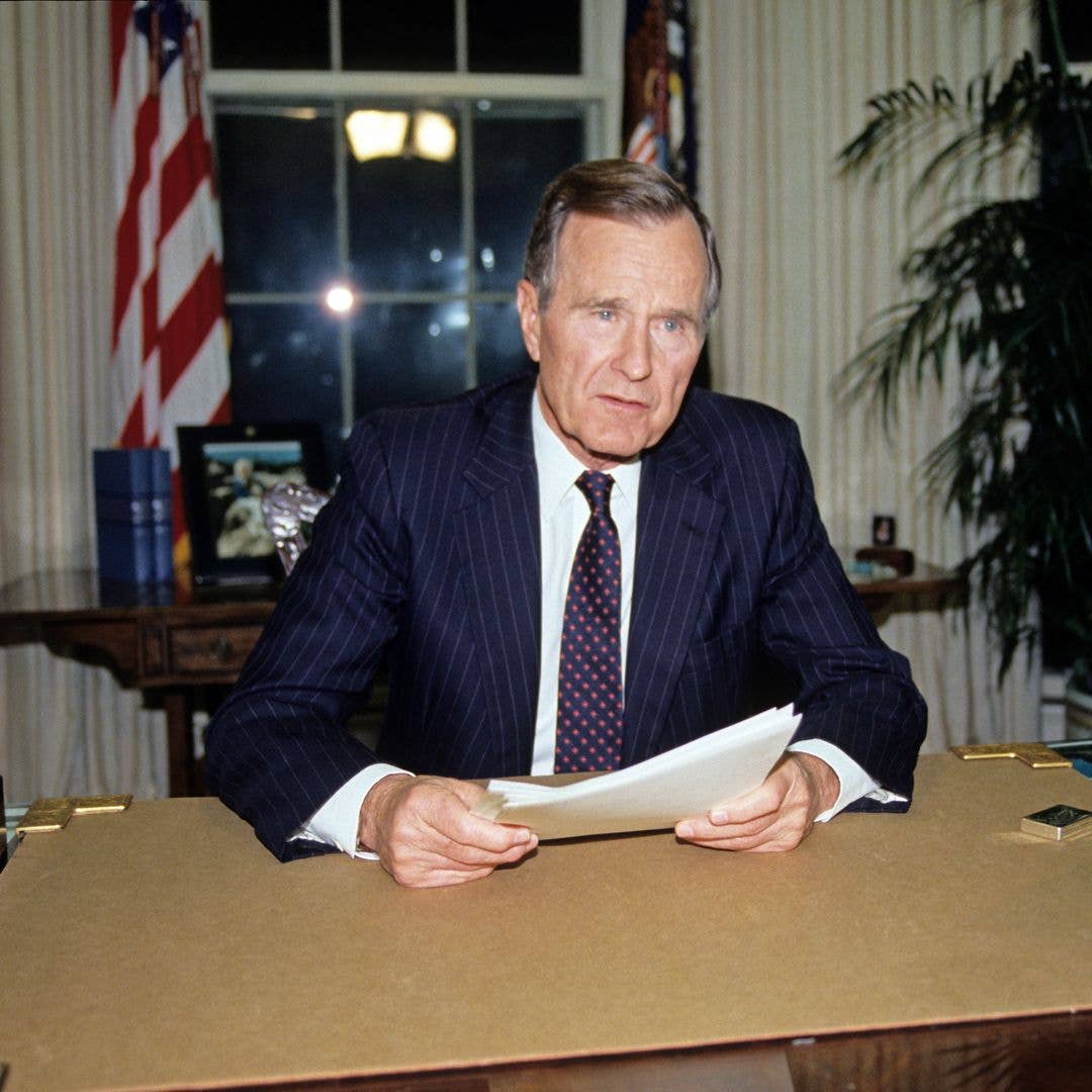US President George HW Bush sits behind his desk in the White House's Oval Office, Washington DC, May 1, 1992. He spoke about ongoing civil disturbances in Los Angeles, California following the Rodney King verdict.