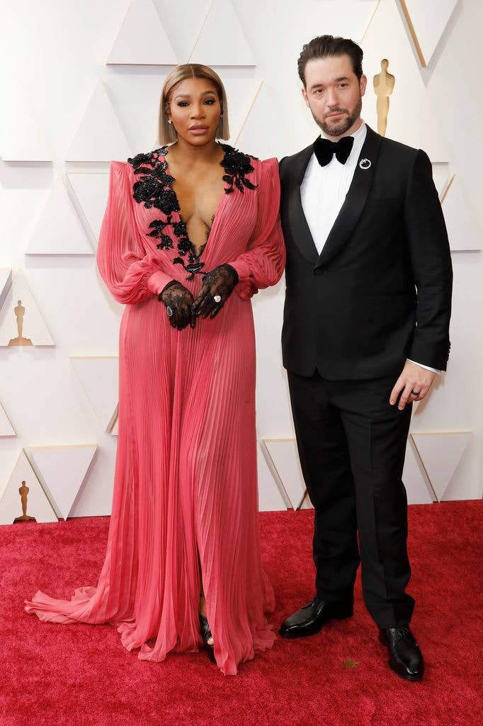 Serena Williams in pink dress and Alexis Ohanian in tuxedo the red carpet at Oscars