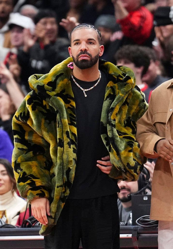 Drake watches on as the Sacramento Kings play the Toronto Raptors during the second half of their basketball game at the Scotiabank Arena on November 2, 2024 in Toronto, Ontario, Canada. NOTE TO USER: User expressly acknowledges and agrees that, by downloading and/or using this Photograph, user is consenting to the terms and conditions of the Getty Images License Agreement. (Photo by Mark Blinch/Getty Images)