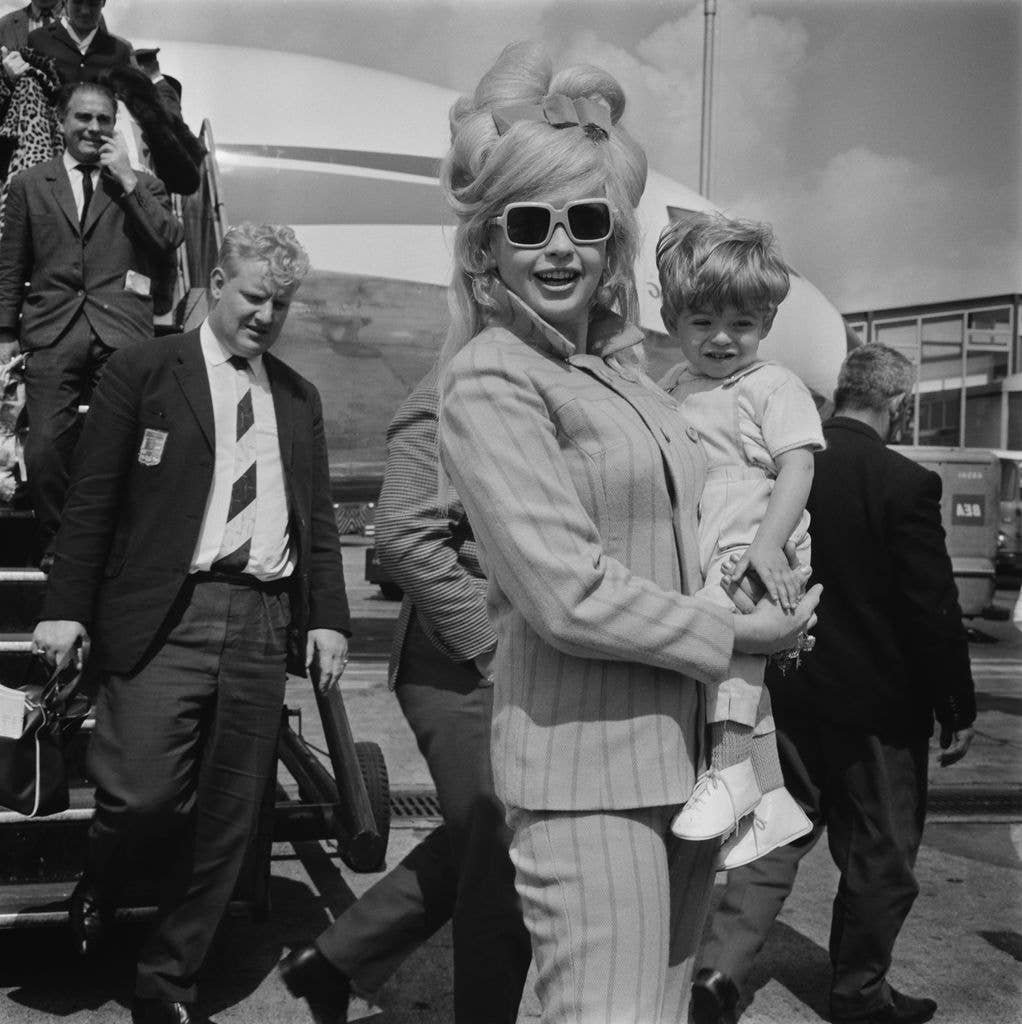 American actress Jayne Mansfield (1933 - 1967) at Heathrow Airport with her son Antonio Raphael Ottaviano, aka Tony Cimber, London, UK, June 1967.
